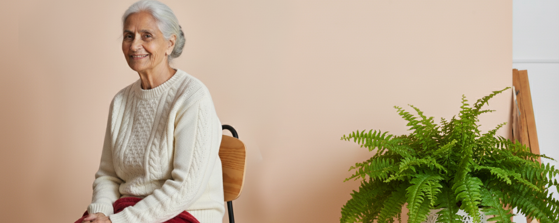 Ink Spot lifestyle scene with an older woman seated beside a fern